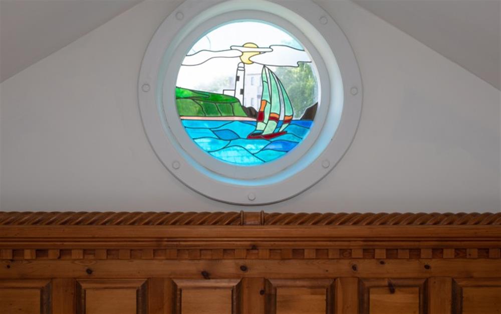 I love the stained glass porthole! at La Mouette in Falmouth