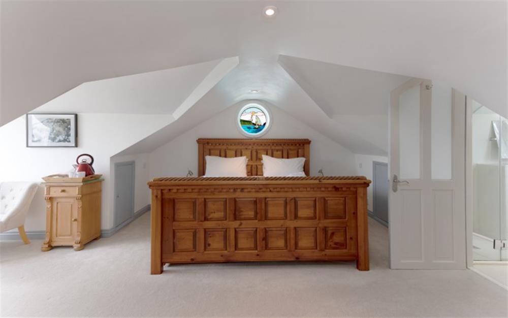 The master bedroom has a romantic feel. En-suite to the right. at La Mouette in Falmouth