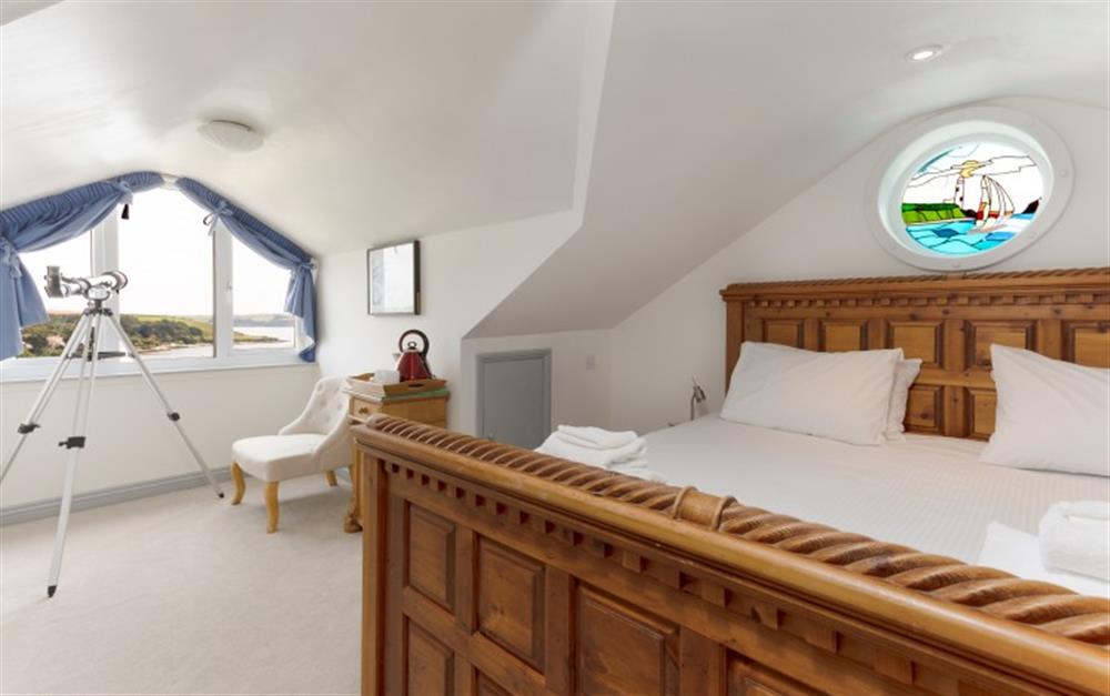 The master bedroom with tea-making facilities and views of the river. at La Mouette in Falmouth