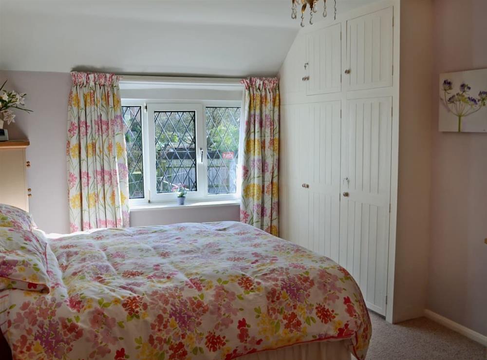 Comfortable double bedroom with king size bed at Lace Cottage in Ashbourne, Derbyshire