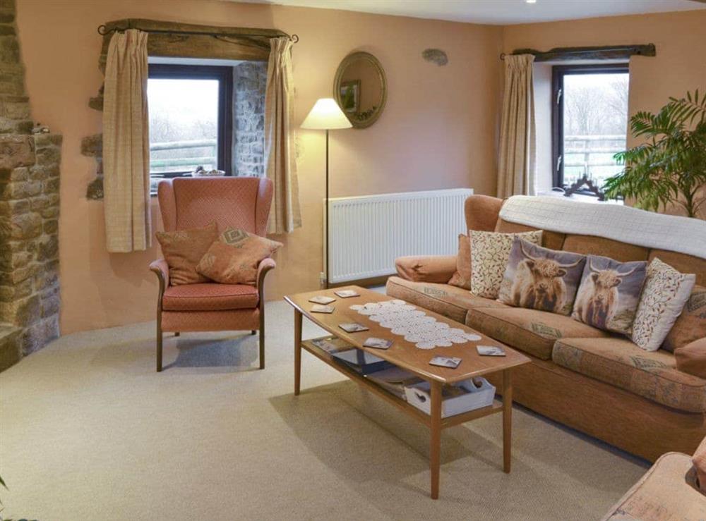 Comfy seating in spacious living room at Ladycroft Barn in Hope Valley, South Yorkshire