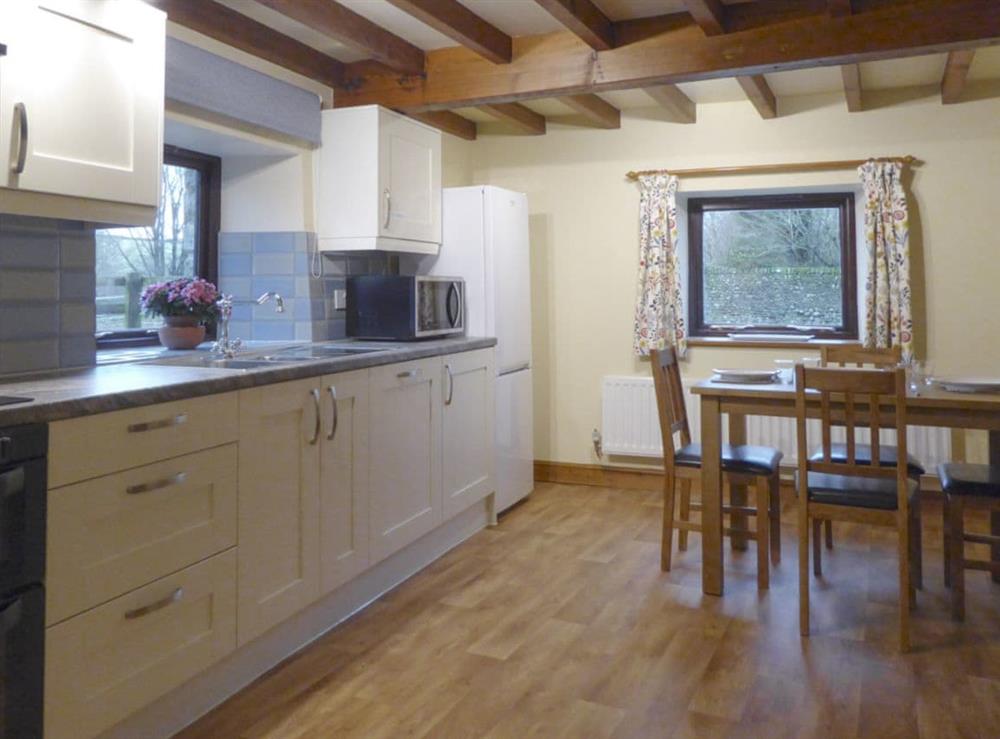 Exposed wooden beams in well-equipped kitchen at Ladycroft Cottage in Hebden, near Skipton, North Yorkshire