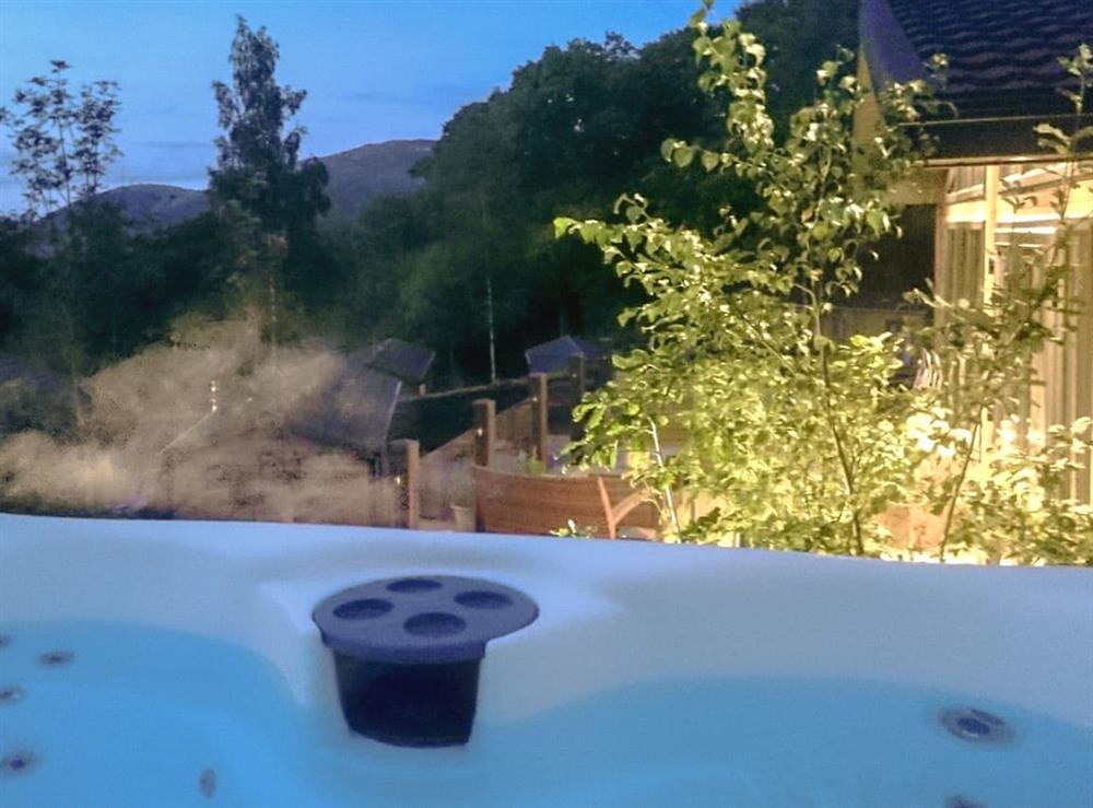 Hot tub at dusk at Lake Bank Lodge in Ulverston, Cumbria