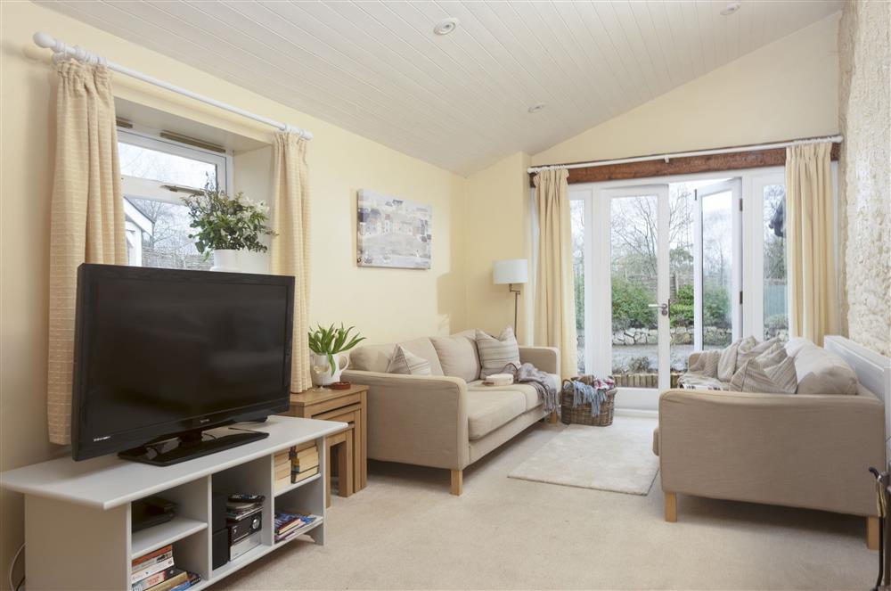 Sitting area with two sofas and a Smart television