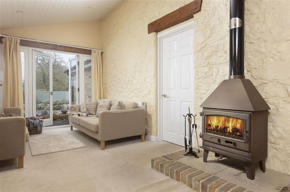 The cosy wood-burning stove warms the area perfectly