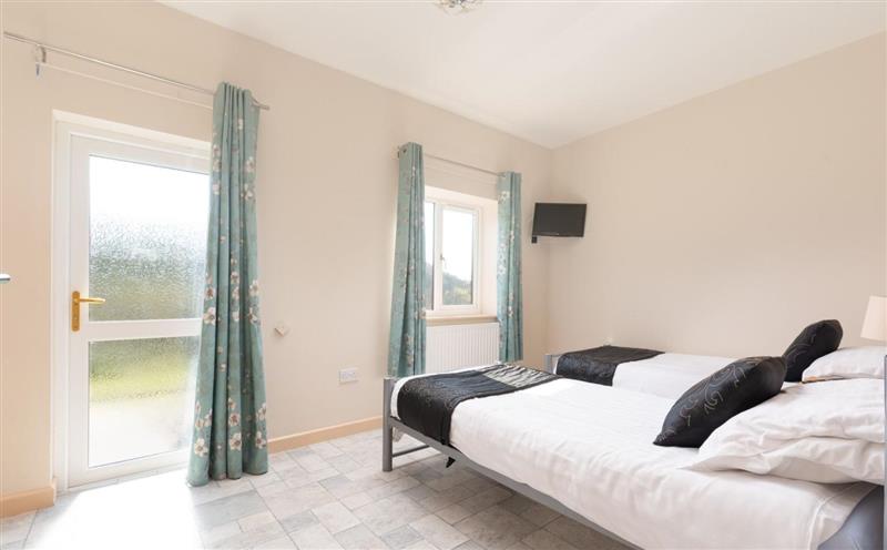 One of the 3 bedrooms at Lake view Cottage, West Down