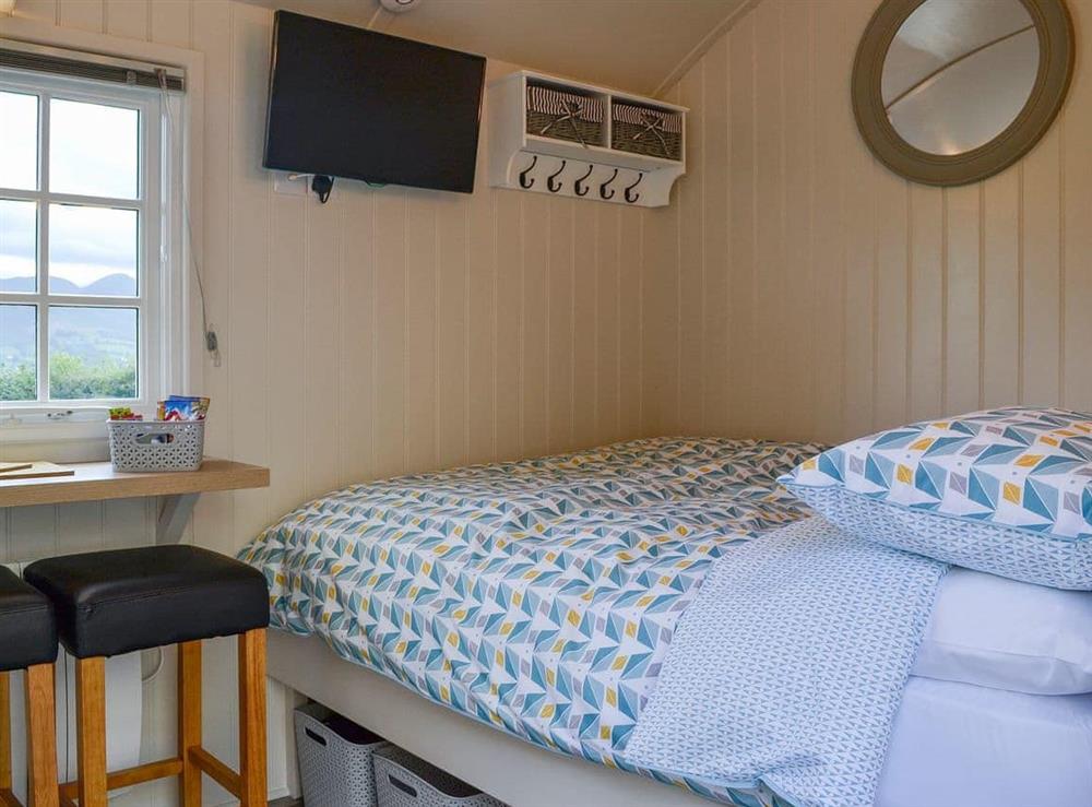 Cosy double bed at Lake View Shepherds Hut in Keswick, Cumbria