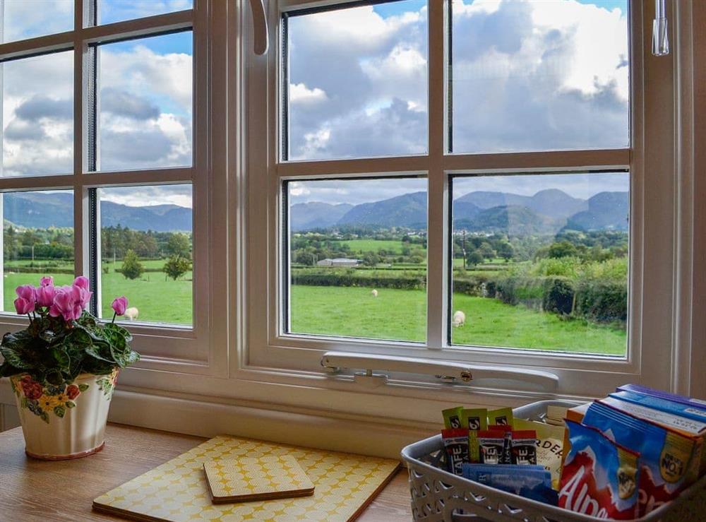 Modest dining area with beautiful surroundings at Lake View Shepherds Hut in Keswick, Cumbria