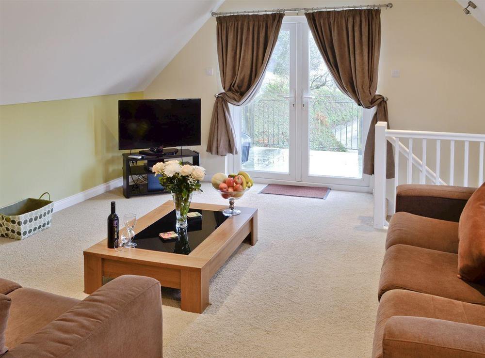 Cosy lounge with french doors at Lake View Villas in Liskeard, Cornwall