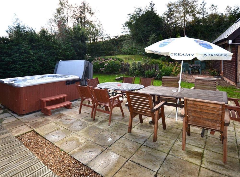 Outdoor area with hot tub at Lakeland Lodge in Kings Lynn, Norfolk