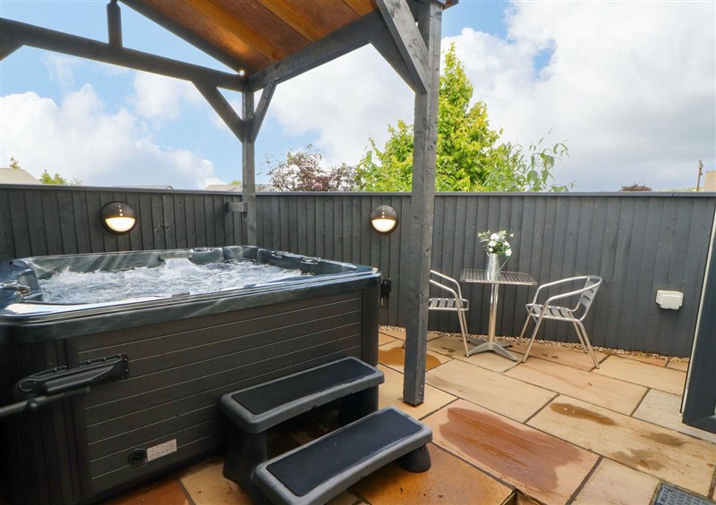 Relax in the hot tub at Lakes View Apartment 1, Carnforth