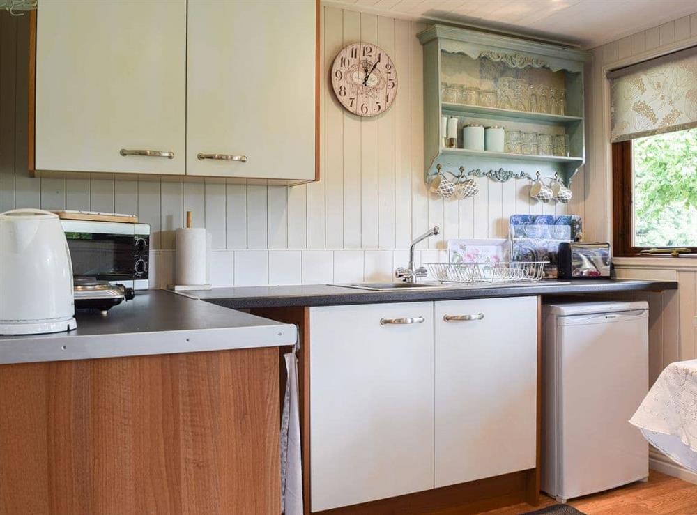 Modest, yet well equipped kitchen at Lakeside Cabin in Kingston Blount, near Thame, Oxfordshire