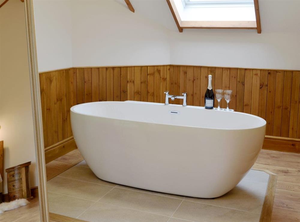 Free-standing bath within the master suite at Lakeside Lodge in near Rhayader, Powys
