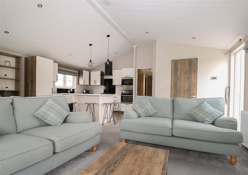 Relax in the living area at Lakeside Lodge, Runcton