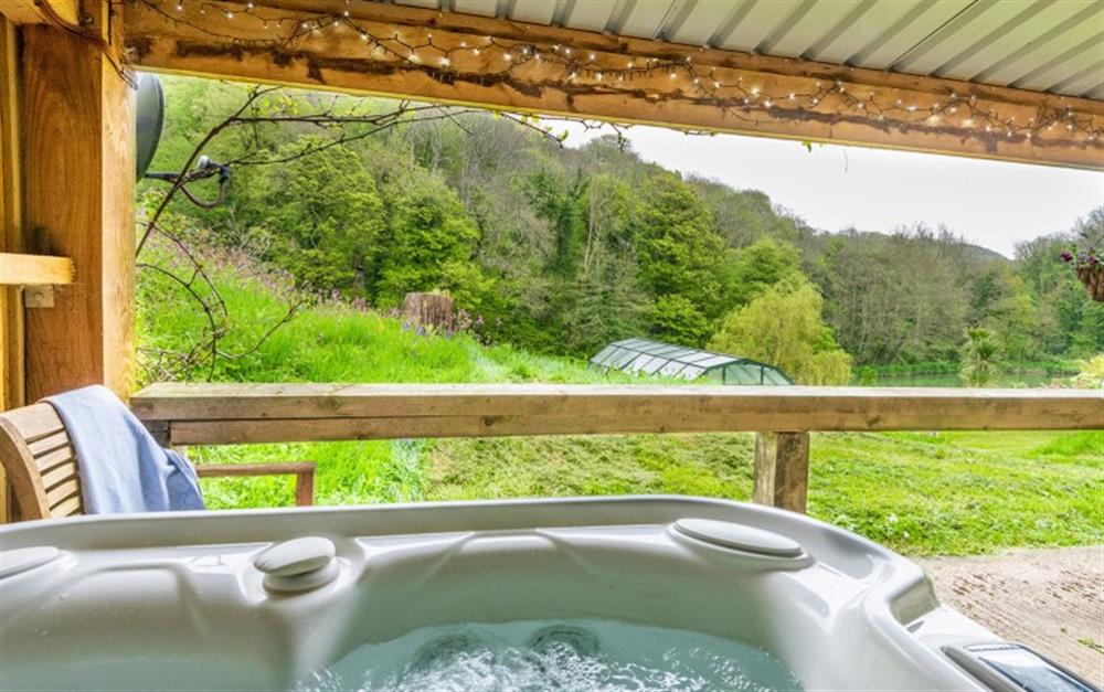 Views from the hot tub over the lakes and grounds at Lakeside Retreat in Sherford