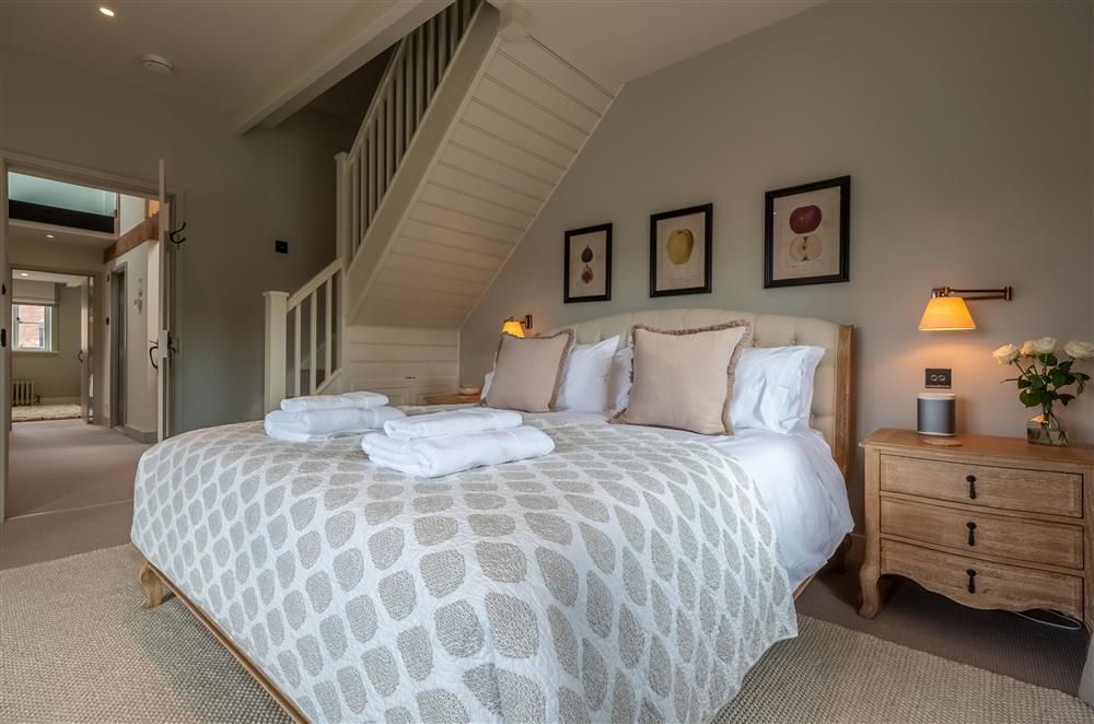 Bedroom one with stairs leading to the en-suite above at Lakeview Oast, Goudhurst