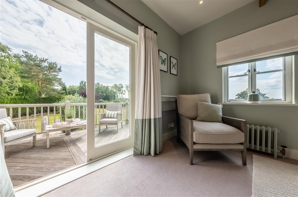 Bedroom three with private balcony and garden views at Lakeview Oast, Goudhurst