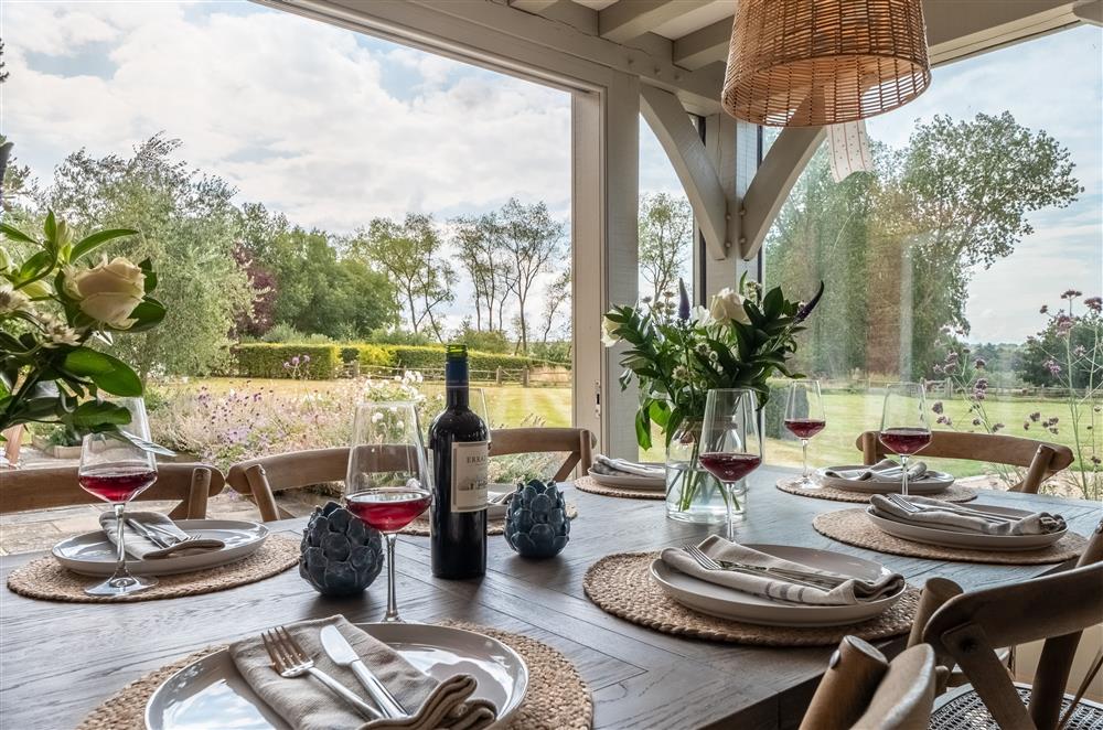 Enjoy the garden views whilst gathered around the dining table at Lakeview Oast, Goudhurst