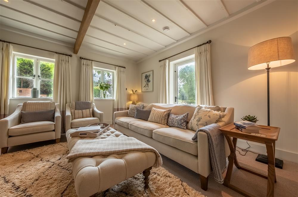 Relax and unwind in the cosy sitting room at Lakeview Oast, Goudhurst