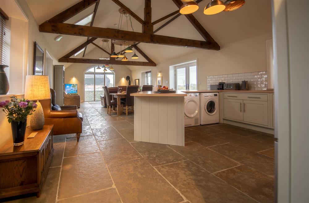 The bright and airy open-plan living area with exposed beams at LaLo, Thirsk, North Yorkshire