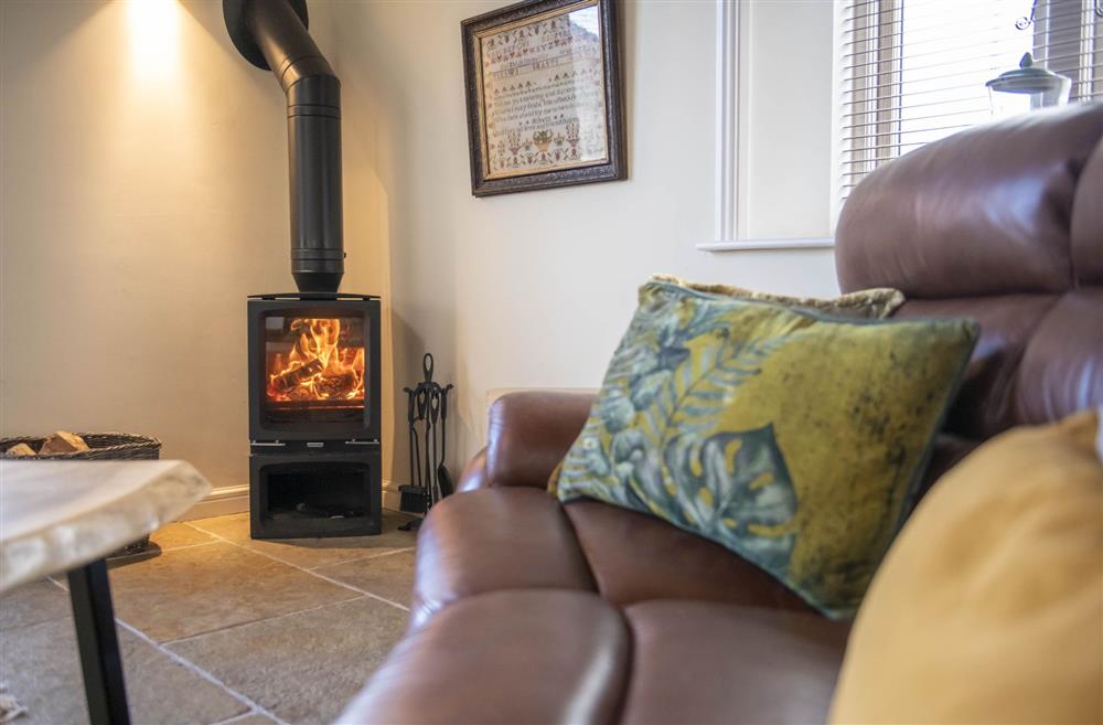 The wood-burning stove in the sitting area creates the perfect atmosphere for a cosy evening in at LaLo, Thirsk, North Yorkshire