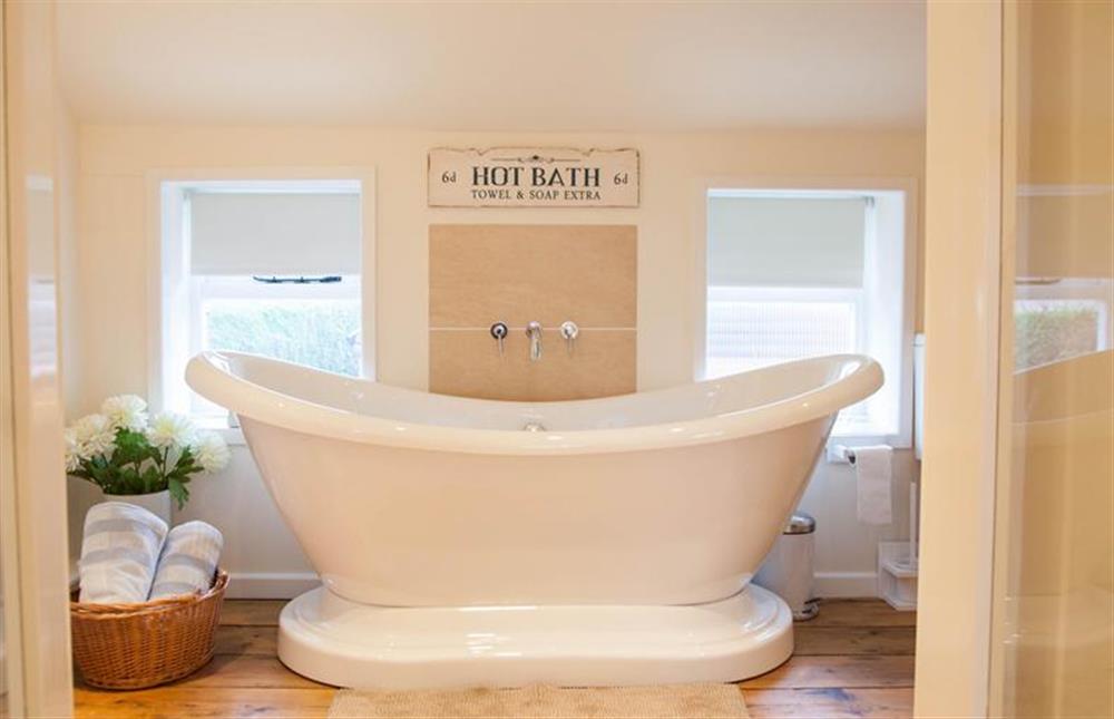 First floor:  En-suite bathroom with feature double-ended bath at Lambert Cottage, Snettisham near Kings Lynn