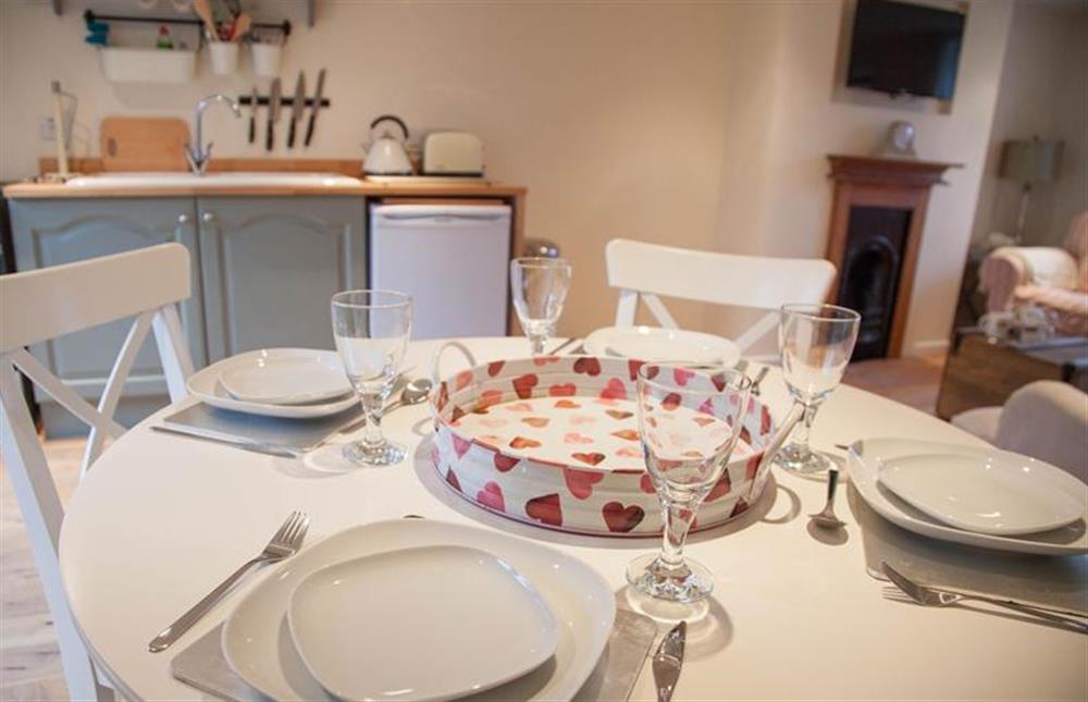 Ground floor:   Dining area with table with seating for four at Lambert Cottage, Snettisham near Kings Lynn