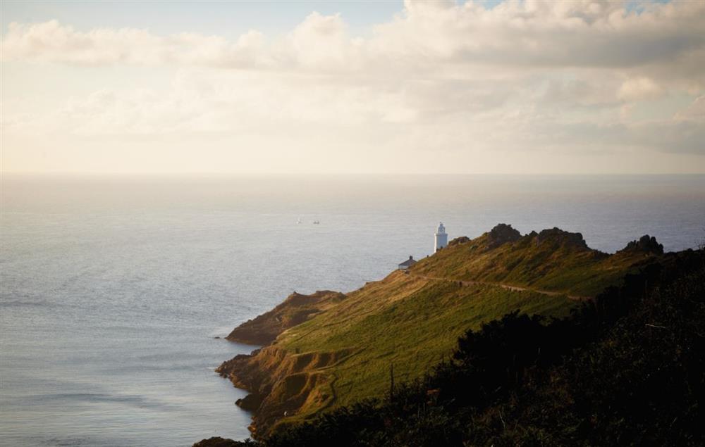 The lighthouse lies on a dramatic headland above Start Bay