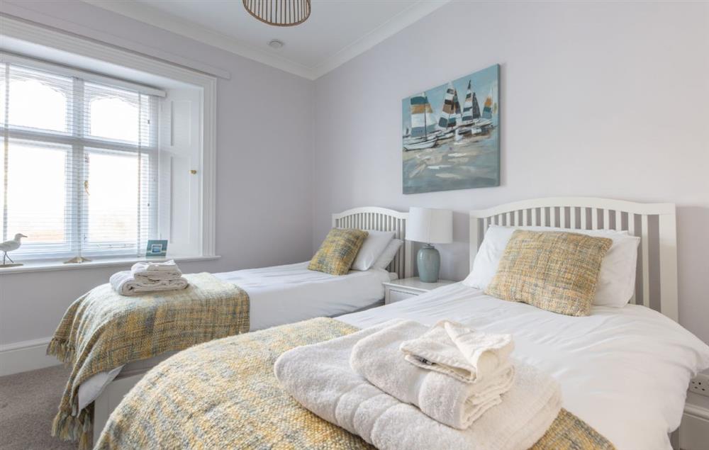 Bedroom with twin 3’ single beds at Landward Cottage (Isle of Wight), St Catherines Lighthouse