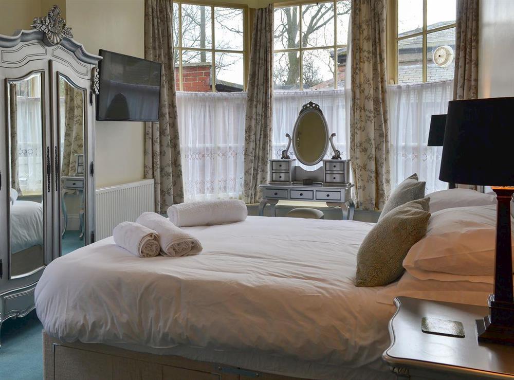 Bedroom with kingsize bed (photo 2) at Langford Villa in Filey, North Yorkshire