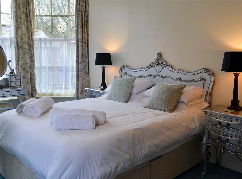 Bedroom with kingsize bed at Langford Villa in Filey, North Yorkshire