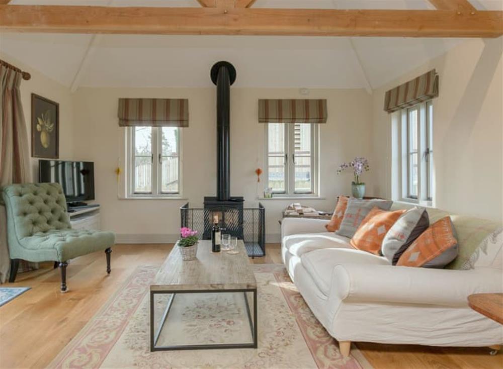 Delightful living room with wood burner at Bull Pen, 