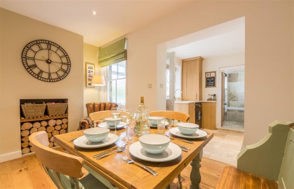 Langleyfts Cottage: Dining room with seating for 4 and a feature fireplace at Langleys Cottage, Heacham near Kings Lynn