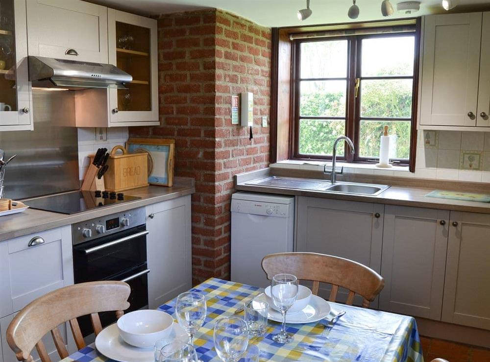 Kitchen with dining area at Lanthorn Cottage in Happisburgh, Norfolk