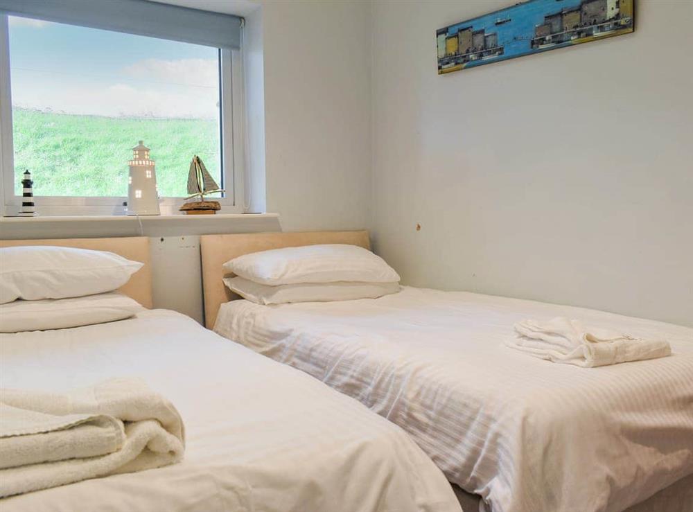 Twin bedroom at Lapwing 1, The Cove in Brixham, Devon