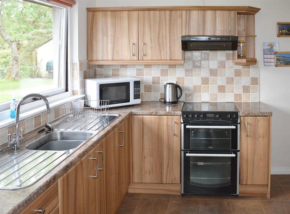 Well-equipped fitted kitchen at Lapwing Rise in Banavie, near Fort William, Highland