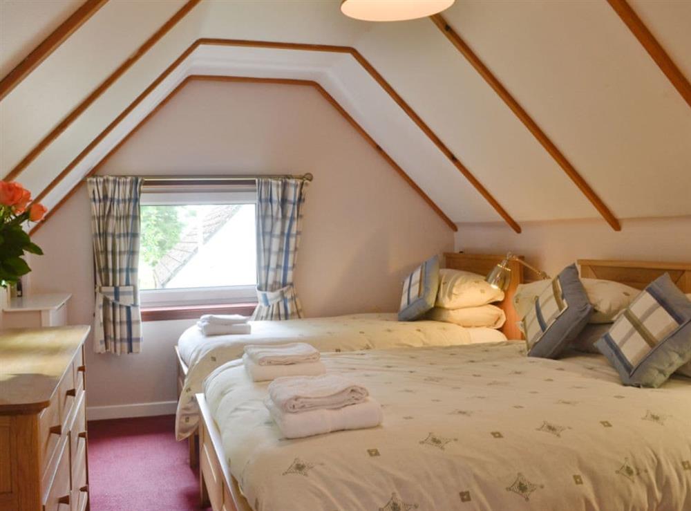 <strong>Bedroom 2, w</strong>ith double bed and single bed at Larch Cottage in Blairmore, near Dunoon, Argyll