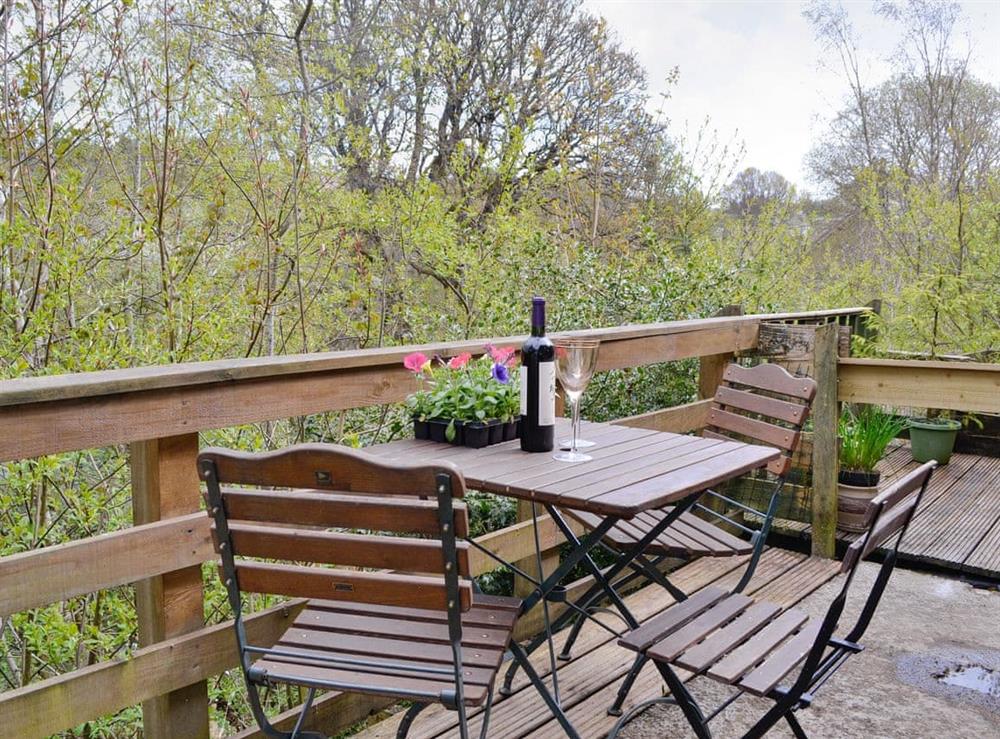 Balcony with outdoor furniture at Larch Cottage in Kirkmichael, near Pitlochry, Perthshire