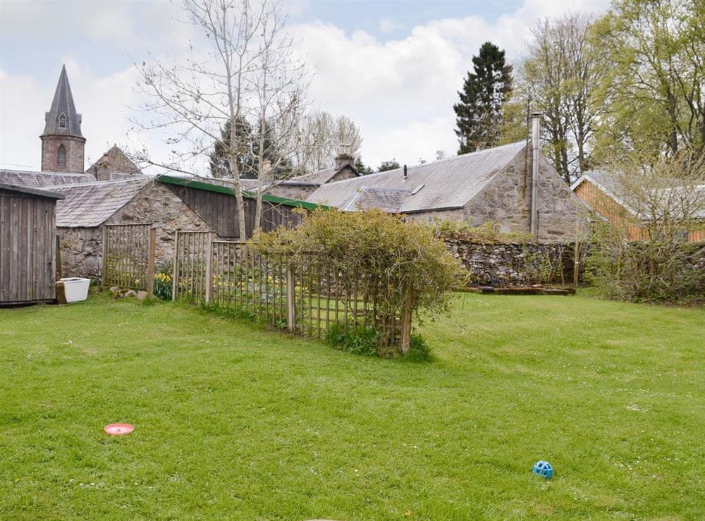 Spacious enclosed garden at Larch Cottage in Kirkmichael, near Pitlochry, Perthshire
