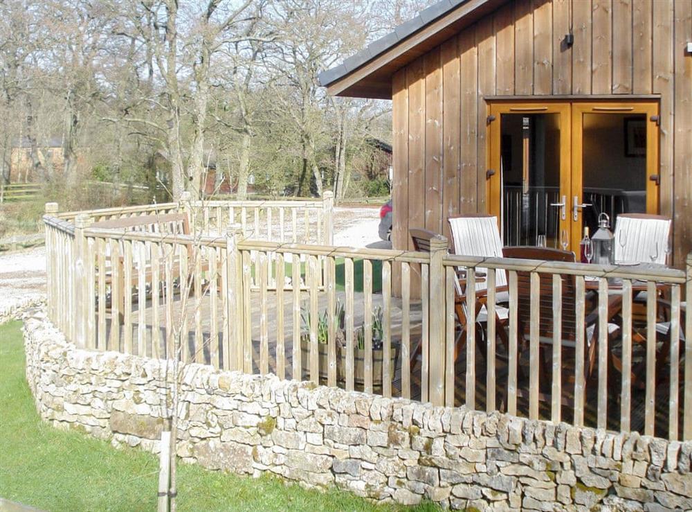 Raised decked area with safety fencing at Larchwood in Dukes Meadow, near Greystoke, Cumbria