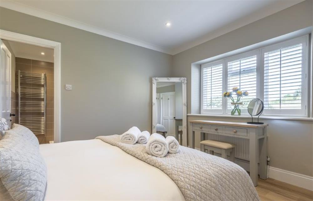 Master bedroom looking to the en-suite shower room at Larks Rise, Burnham Market near Kings Lynn