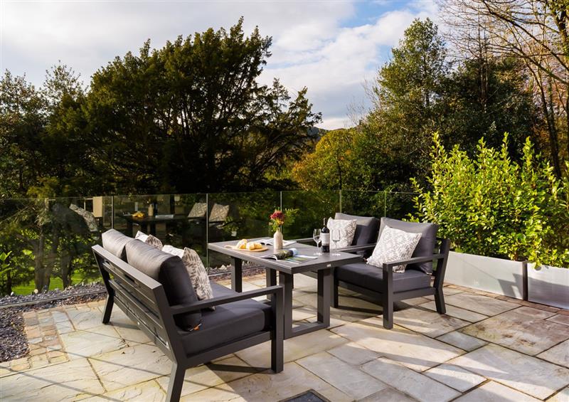 Enjoy a glass of wine on the patio at Larna Place, Ambleside