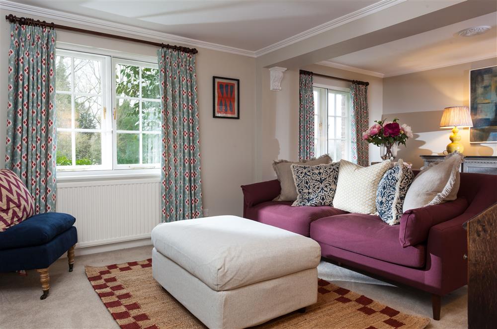 Relax in the cosy sitting room after a day of exploring at Laundry Cottage, Arley