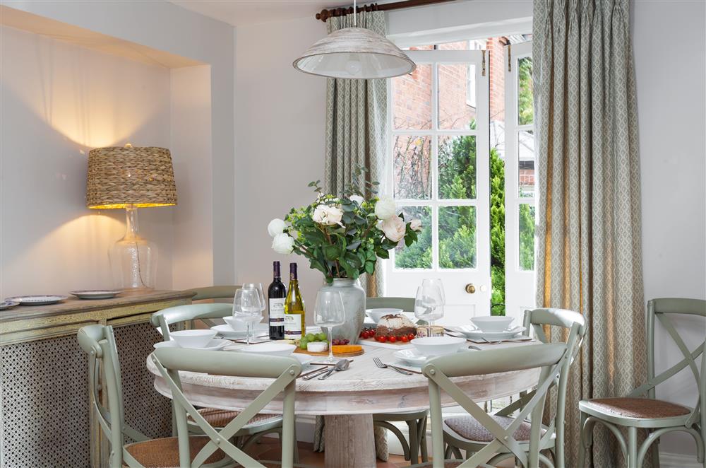 The dining area with french doors leading to the garden at Laundry Cottage, Arley