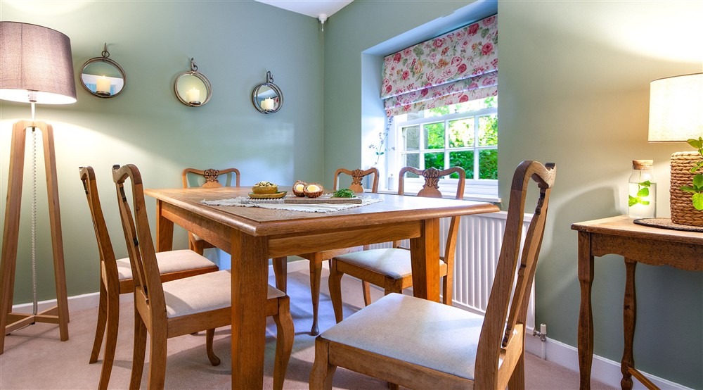 The dining room with chairs for six at Laundry Cottage in Morpeth, Northumberland