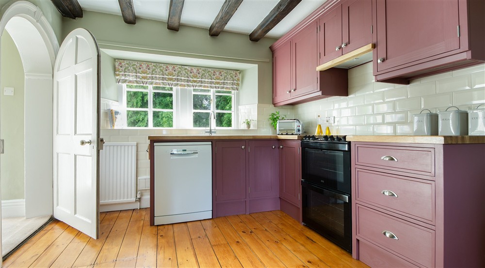 The kitchen with dishwasher, toaster, oven and hob at Laundry Cottage in Morpeth, Northumberland