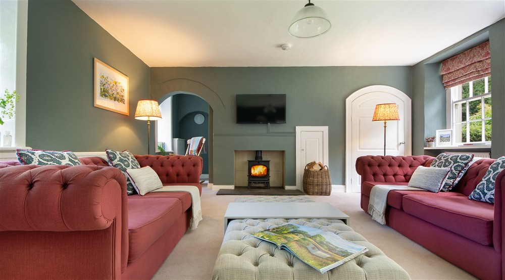 The sitting room with sofas, television and woodburner (photo 2) at Laundry Cottage in Morpeth, Northumberland
