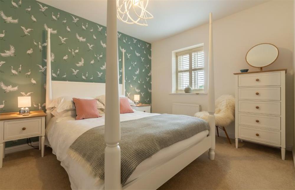 First floor: Bedroom two with king-size four poster bed at Lavandula, Burnham Market near Kings Lynn