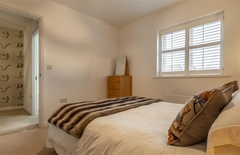 First floor: Master bedroom with a king-size bed (photo 2) at Lavandula, Burnham Market near Kings Lynn