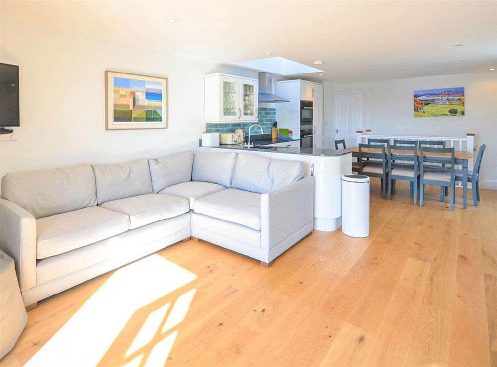 Open plan sitting area and kitchen on the first floor at Lavausa in St Mawes, Cornwall